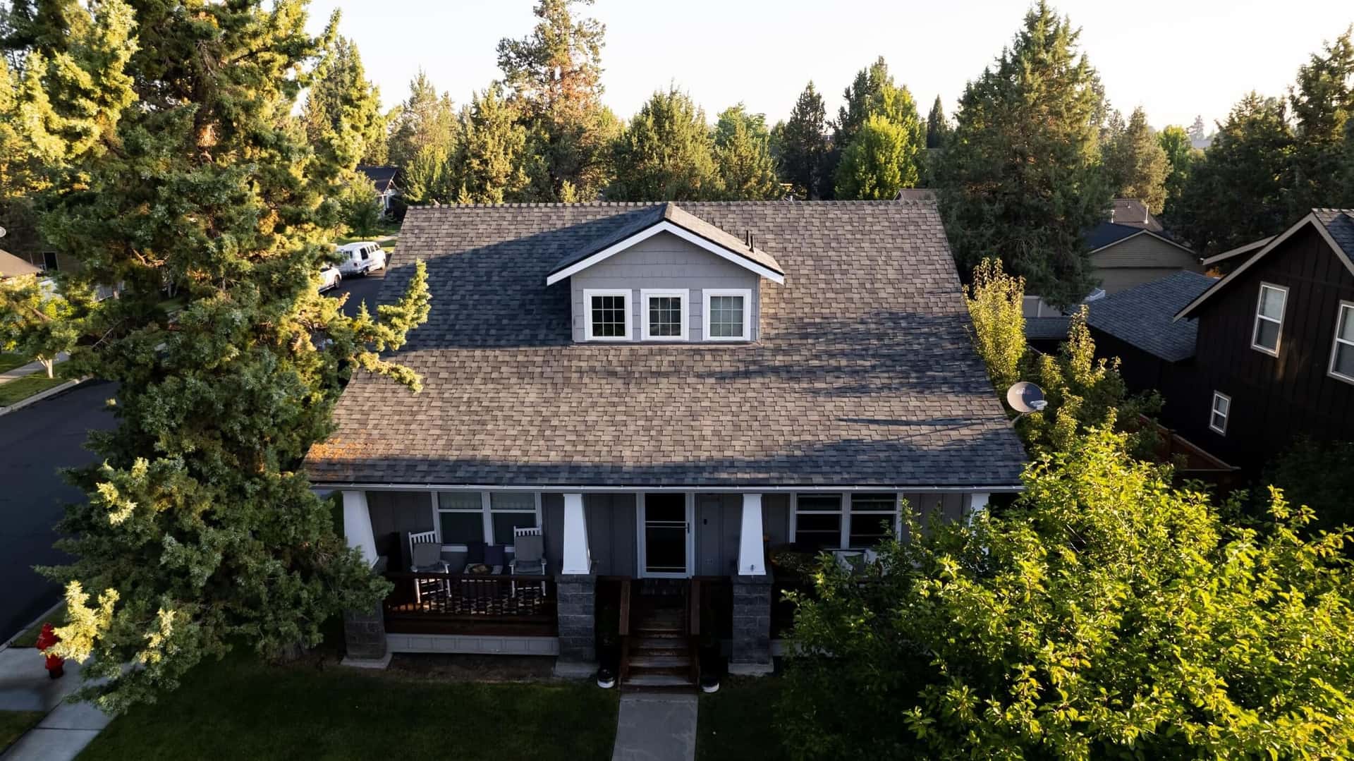 Aerial view of a completed Greenlee Roofing shingle roof in a Bend, Oregon neighborhood